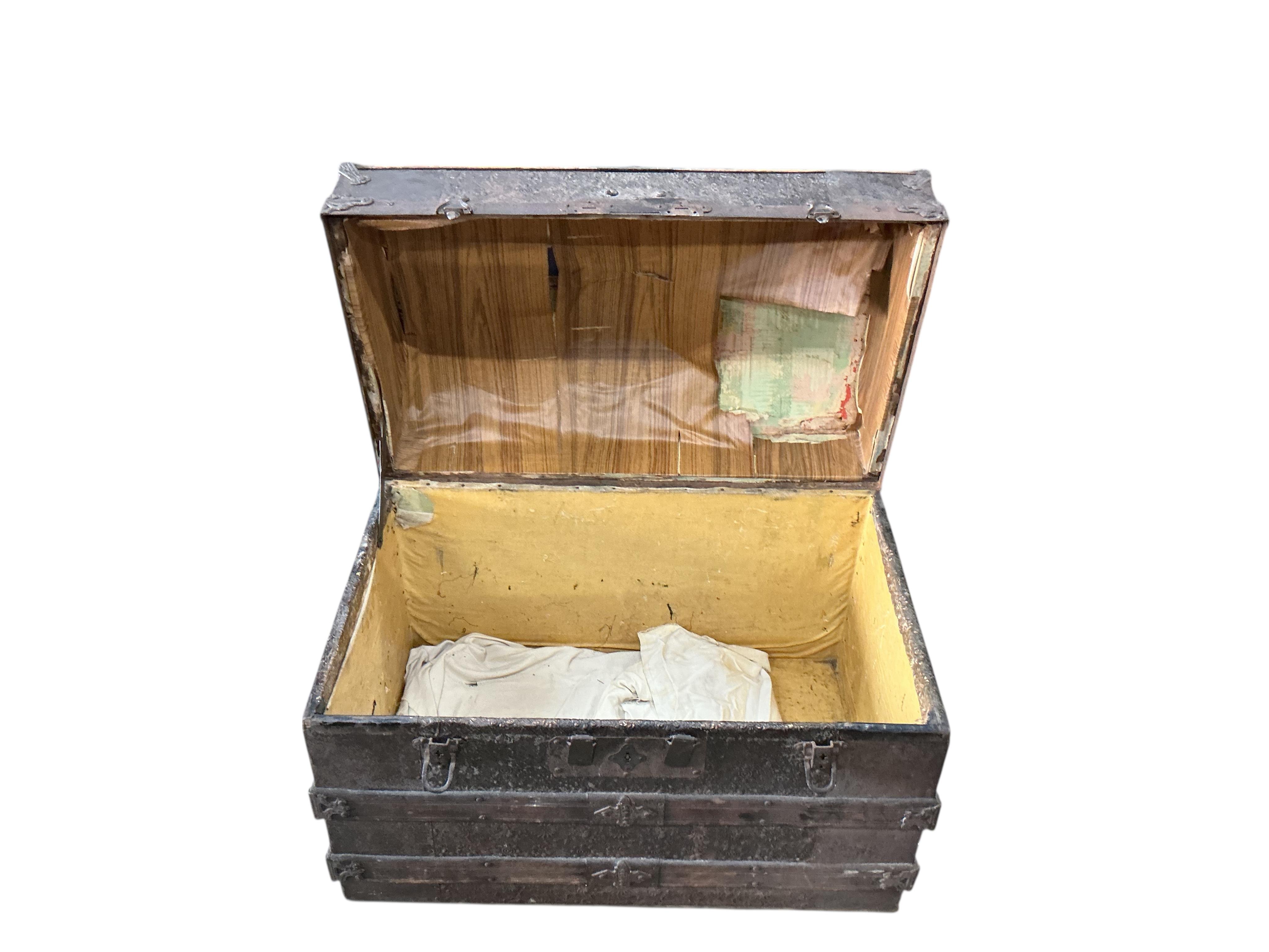 A Victorian metal mounted wood bound domed trunk, width 75cm, depth 46cm, height 54cm